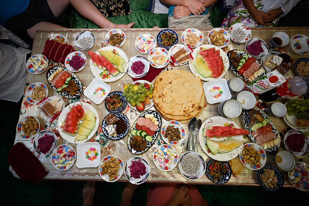 Party meal in Bukhara prepared by locals for Wendy's family, Uzbekistan.