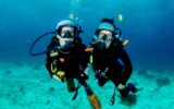 Traveler Andrea Phillips and daughter Rachel underwater, diving off Balicasag Island, Bohol, Philippines.