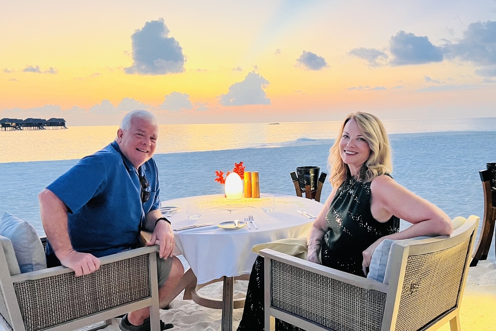 Barbara Mace and husband Joe at their anniversary dinner on the beach at the Vakkaru Maldives resort during sunset.