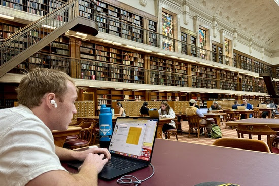 Wendy's son and other people studying at State Library in New South Wales.