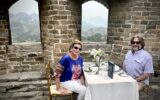 Travelers Emma Jacobs and her husband dining on the Great Wall of China during their WOW Moment.