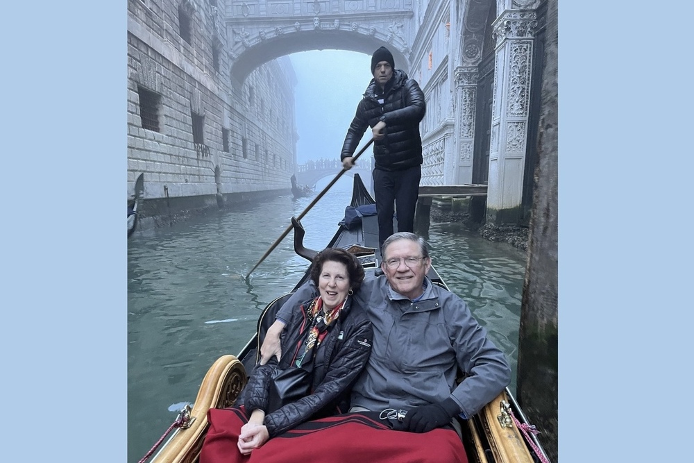 Marsha Friedli and her husband during their gondola ride in Venice on a foggy day.