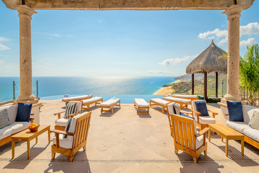 The patio at Villa Turquesa overlooking the ocean on a sunny day, Los Cabos, Mexico.