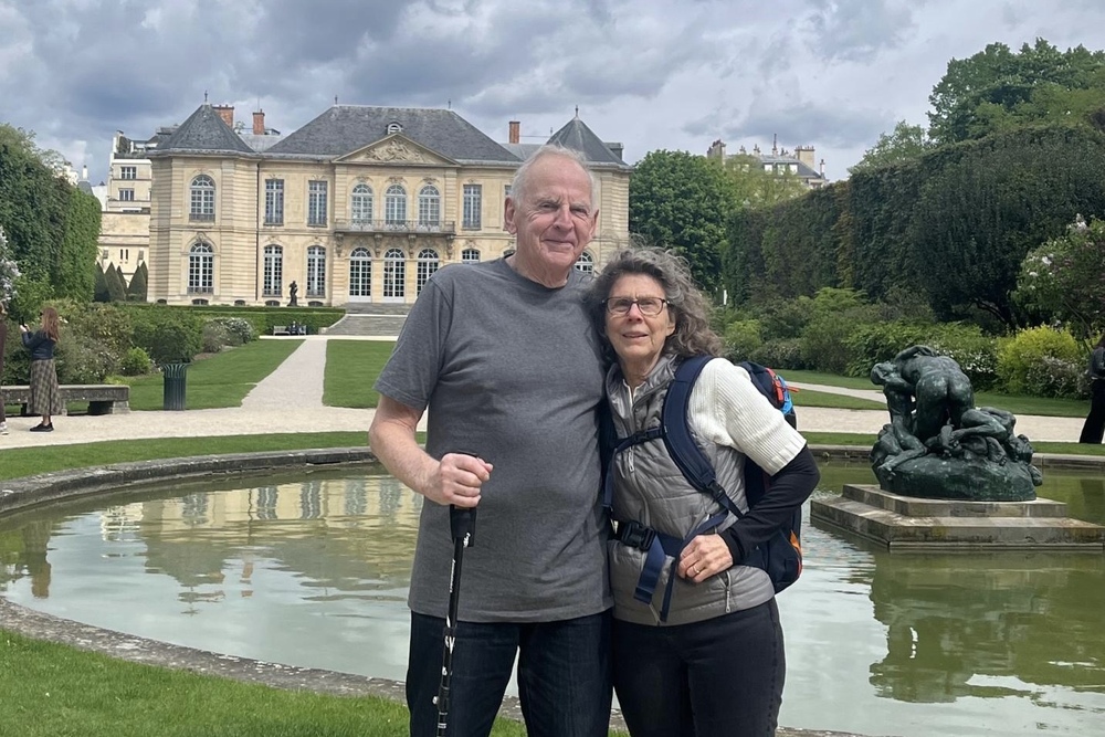 Travelers Sheila Morse and husband Dick Smith in the garden at the Rodin Museum on a cloudy day, Paris, France.