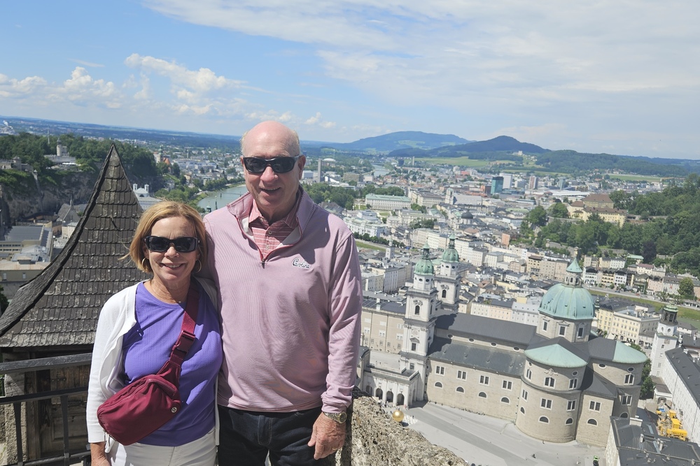 Travelers Louise and Lee Andrews at the Hohensalzburg Fortress, overlooking the city of Salzburg, Austria.