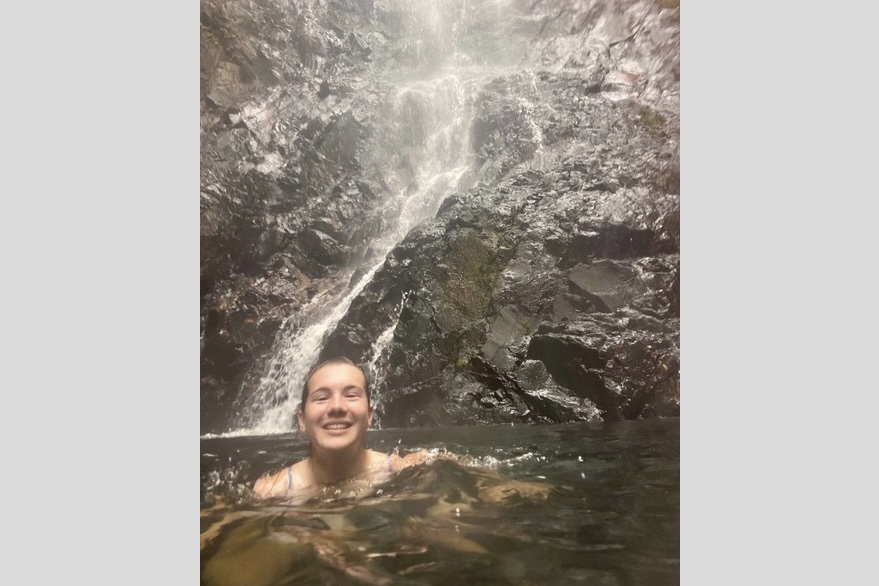 Doug Nury's daughter Kate swimming under Butterfly Falls at Hidden Valley Inn, Belize.