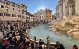 Crowds around Trevi Fountain in Rome, Italy.