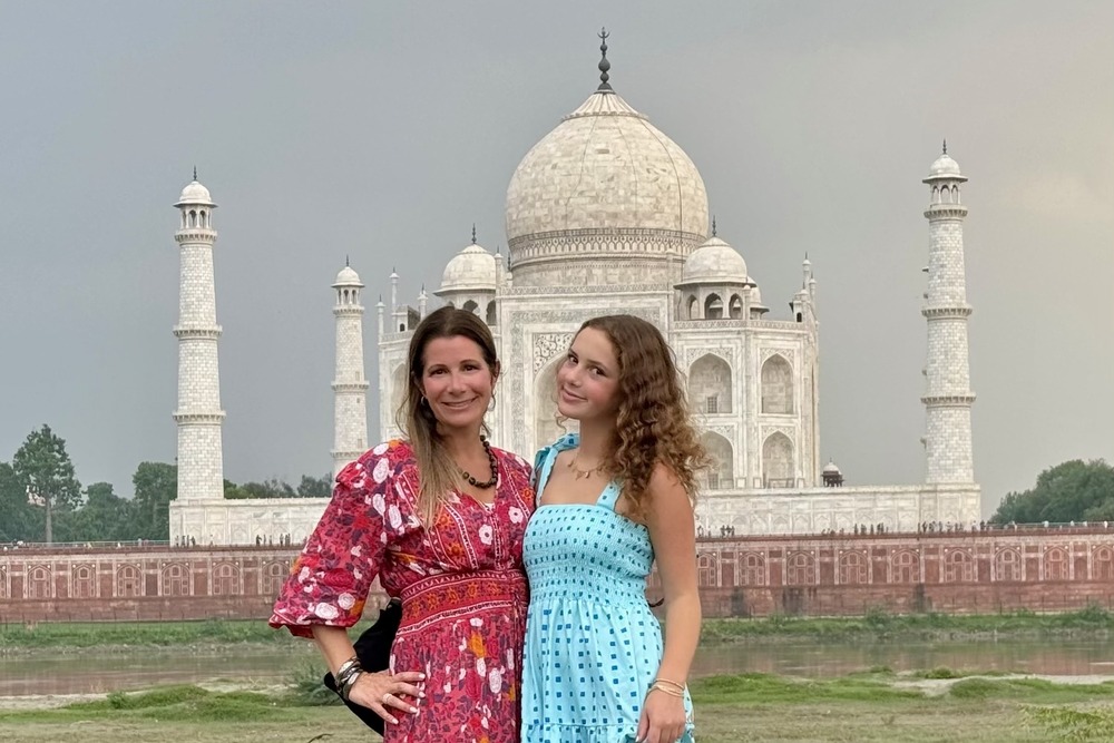 Lauren Schor and her daughter in front of Taj Mahal in India.