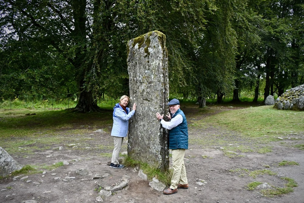 Susan Ketchum and her husband at a prehistoric cemetery in Inverness, Scotland.