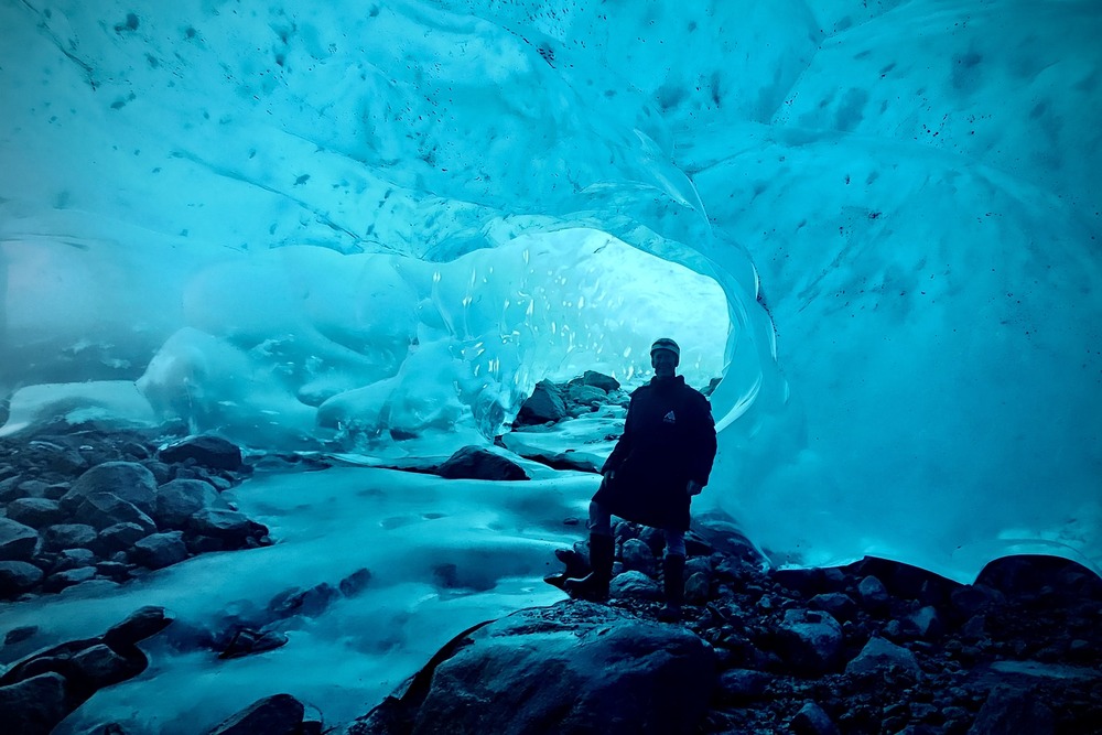 Traveler Todd Fitzwater hiking in a glacier cave in Whistler, British Columbia, Canada.