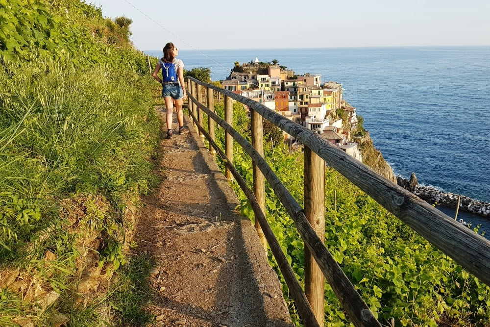 Hiking in Cinque Terre while enjoying the beautiful beach view.