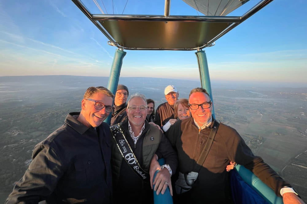 Jim Schleif, his partner and friends on a hot air balloon ride over Luberon, France.