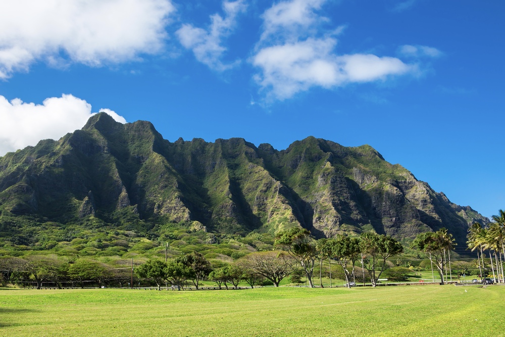 Koolau mountain range and green field in Hawaii.