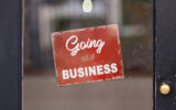 Red closed sign with " Gping out of business " written on it.