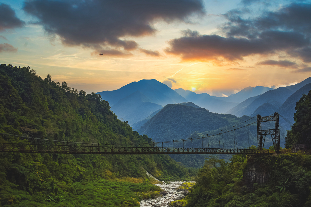 Sunrise view of a bridge and the mountains of Arunachal Pradesh, Northeast India.