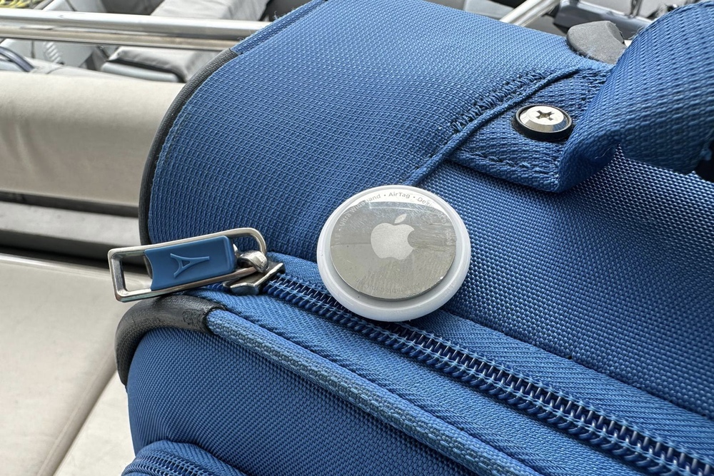 The Apple AirTag on the luggage.