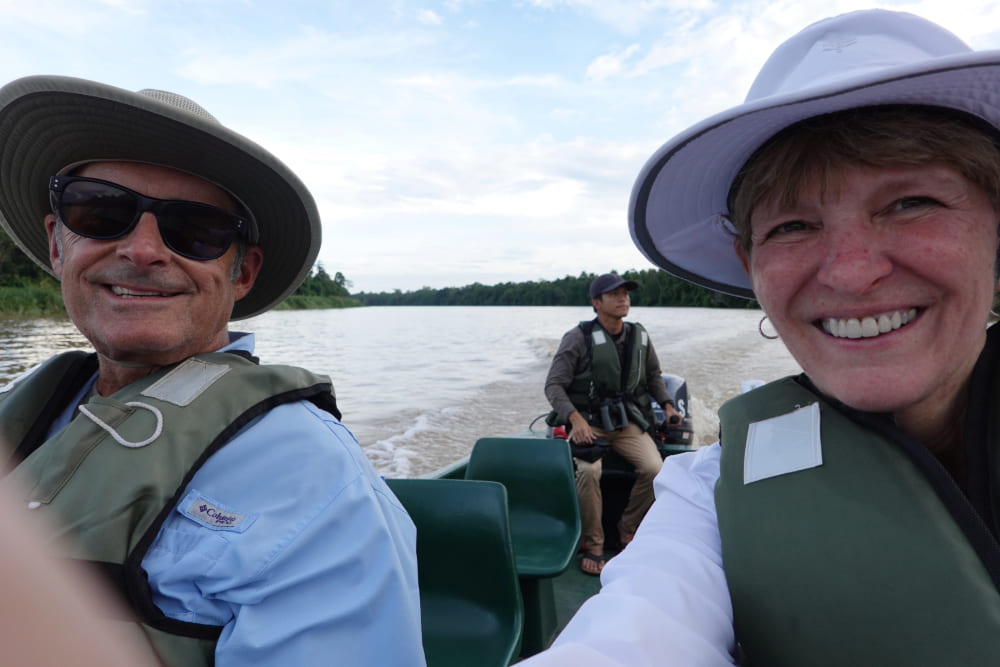 Barbara and Larry Schoenfeld on the Kinabatangan River in Borneo, Malaysia.