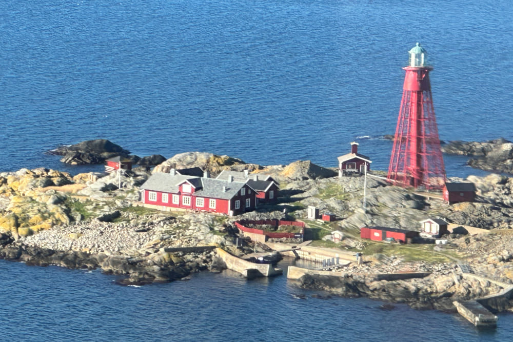 Aerial view of houses and Pater Noster lighthouse on Hamneskar island, Sweden.