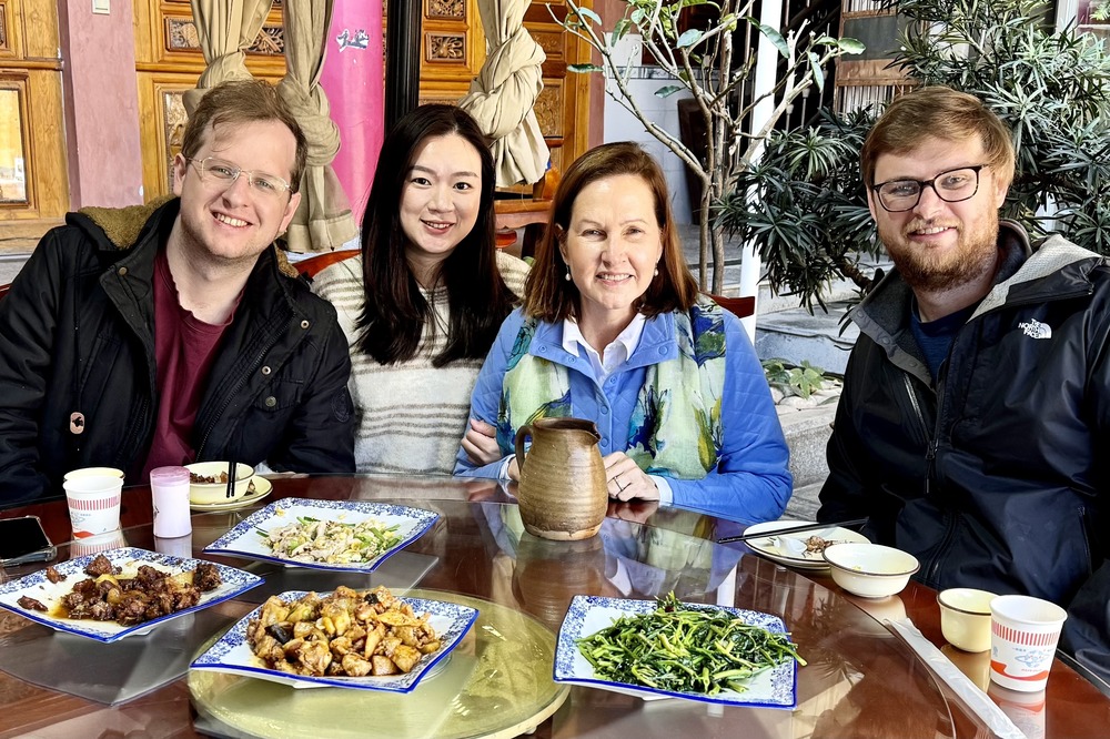 Kathryn Wilson and family having a meal in China.