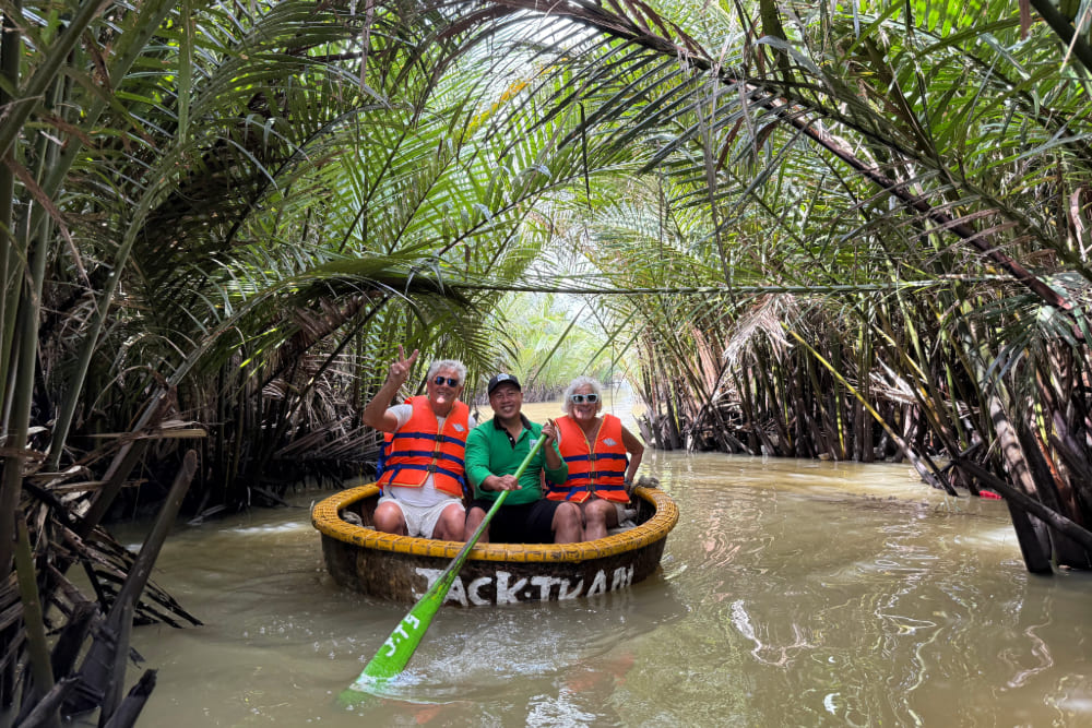 Floating through Vietnam’s coconut flower groves on a bucket boat.