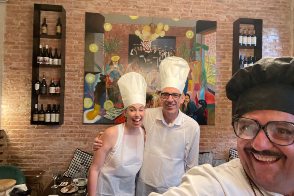 Virginia and husband Joe cooking with Chef Maurizio at Macalle in Siracusa, Sicily.