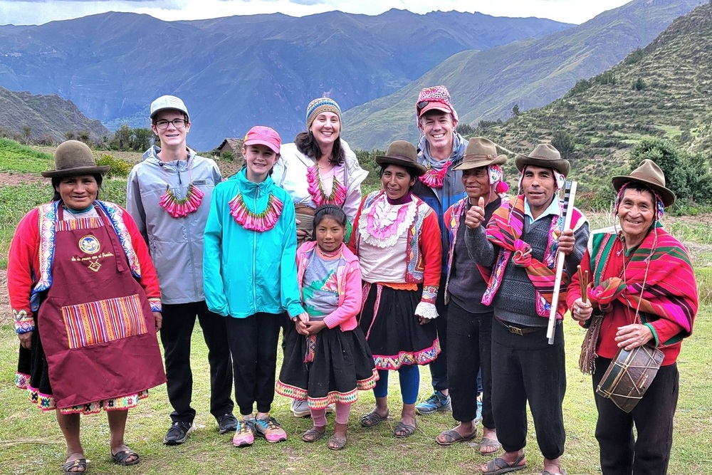 Audrey Moore with family and the Lamay community at the Sacred Valley in Peru.