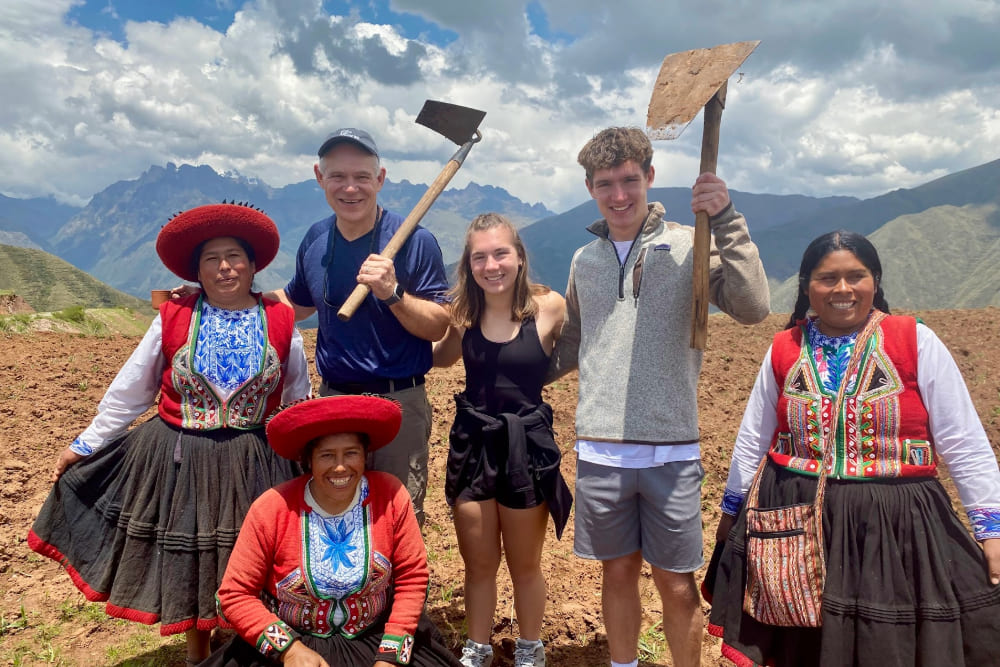 Doug, Kate and Will Nury help with planting crops in Peru.