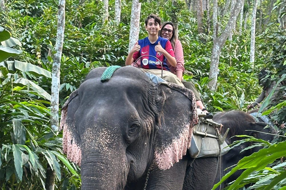 Gurminder Bedi's daughter and grandson riding an elephant in India.