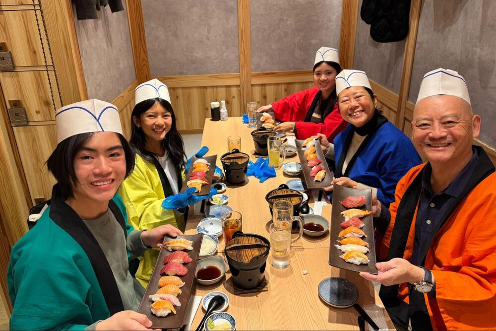 Jennifer Cheng and family at a sushi making class in Japan.