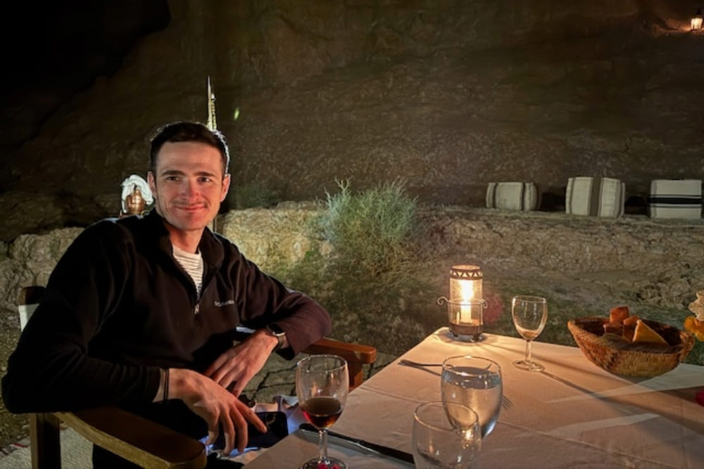 Joseph McBrine having dinner in the Agafay desert, in Morocco.