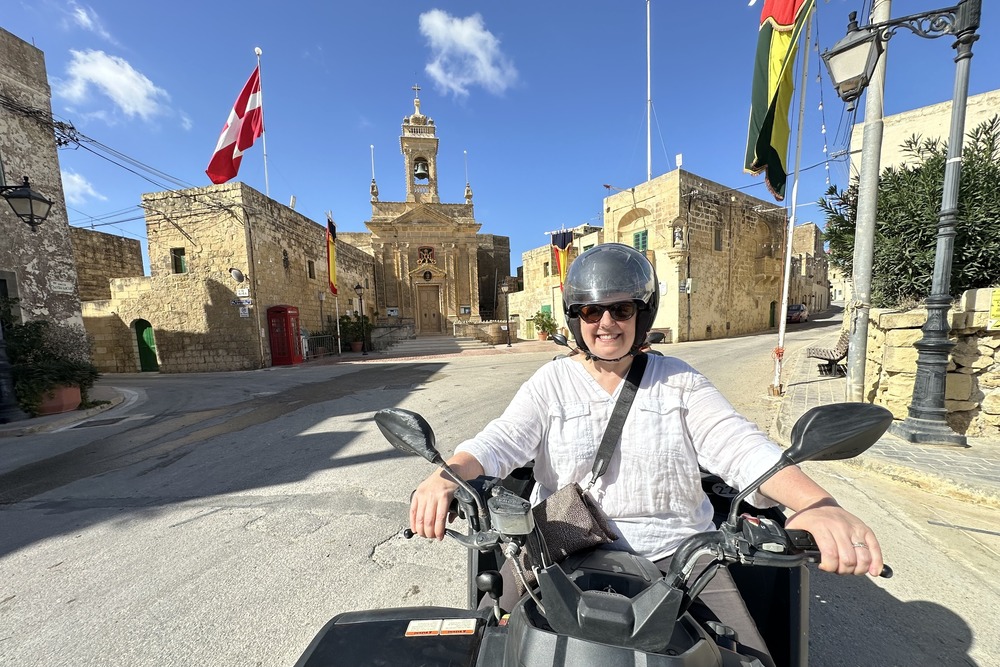 Wendy Perrin driving an ATV in Gozo, Malta.