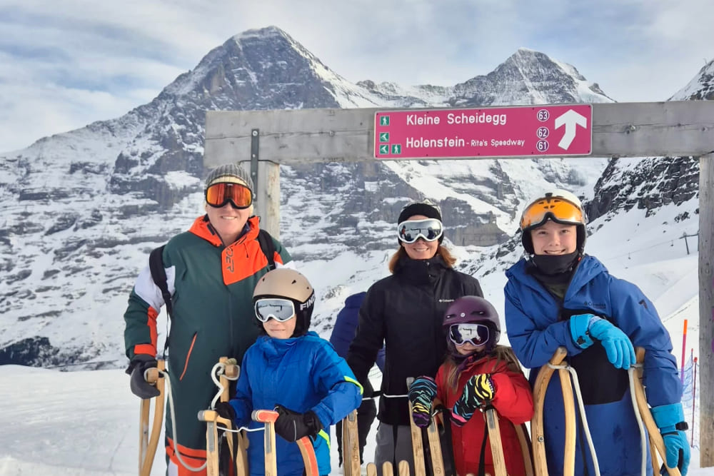 Ashley Point and family sledging in Grindelwald, Switzerland.