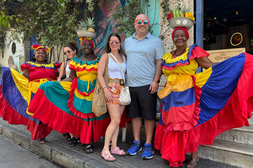 Lauren Schor and family with the iconic Palenqueras of Cartagena.