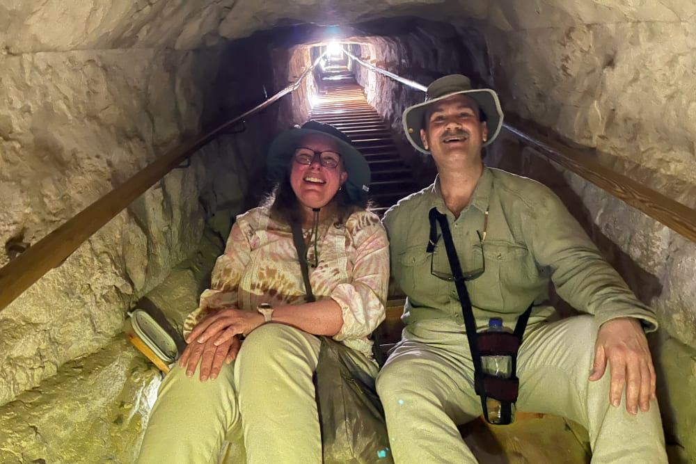 Stephanie and Craig Smith ascending the 85-meter shaft in the Bent Pyramid, in Egypt.