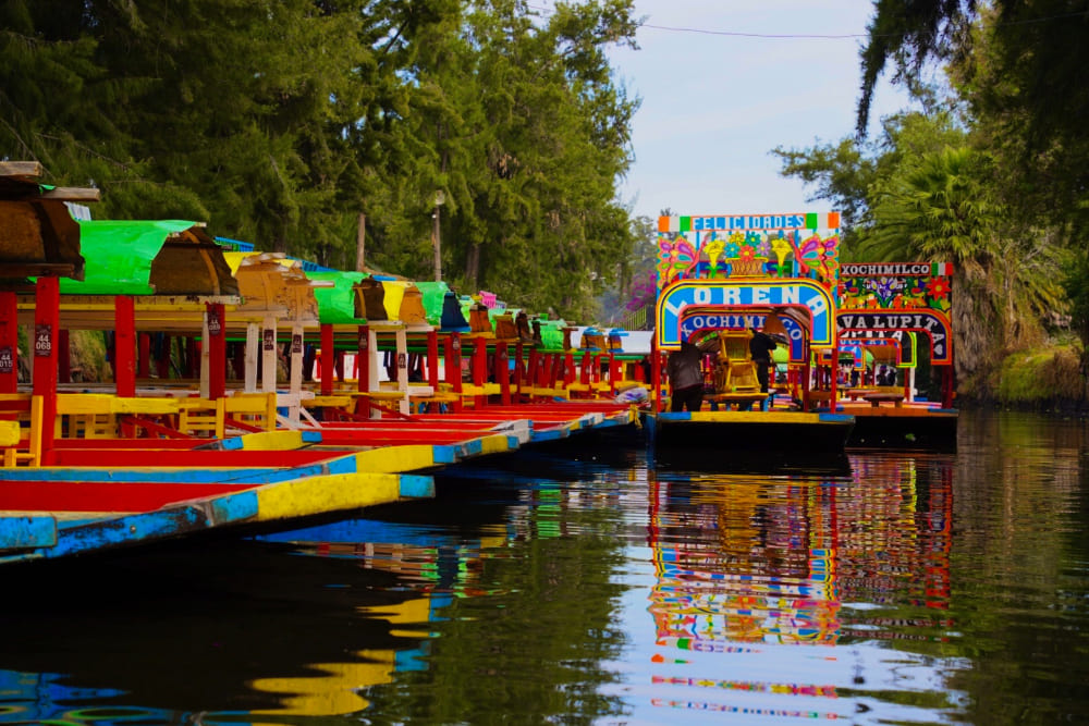 Canal with trajineras in Xochimilco, Mexico.