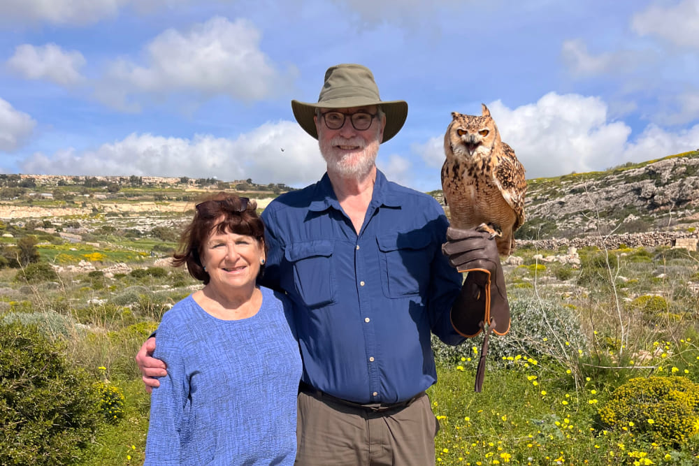 Jan Heininger and Jamie Reuter with an owl during a falconry experience in Malta.